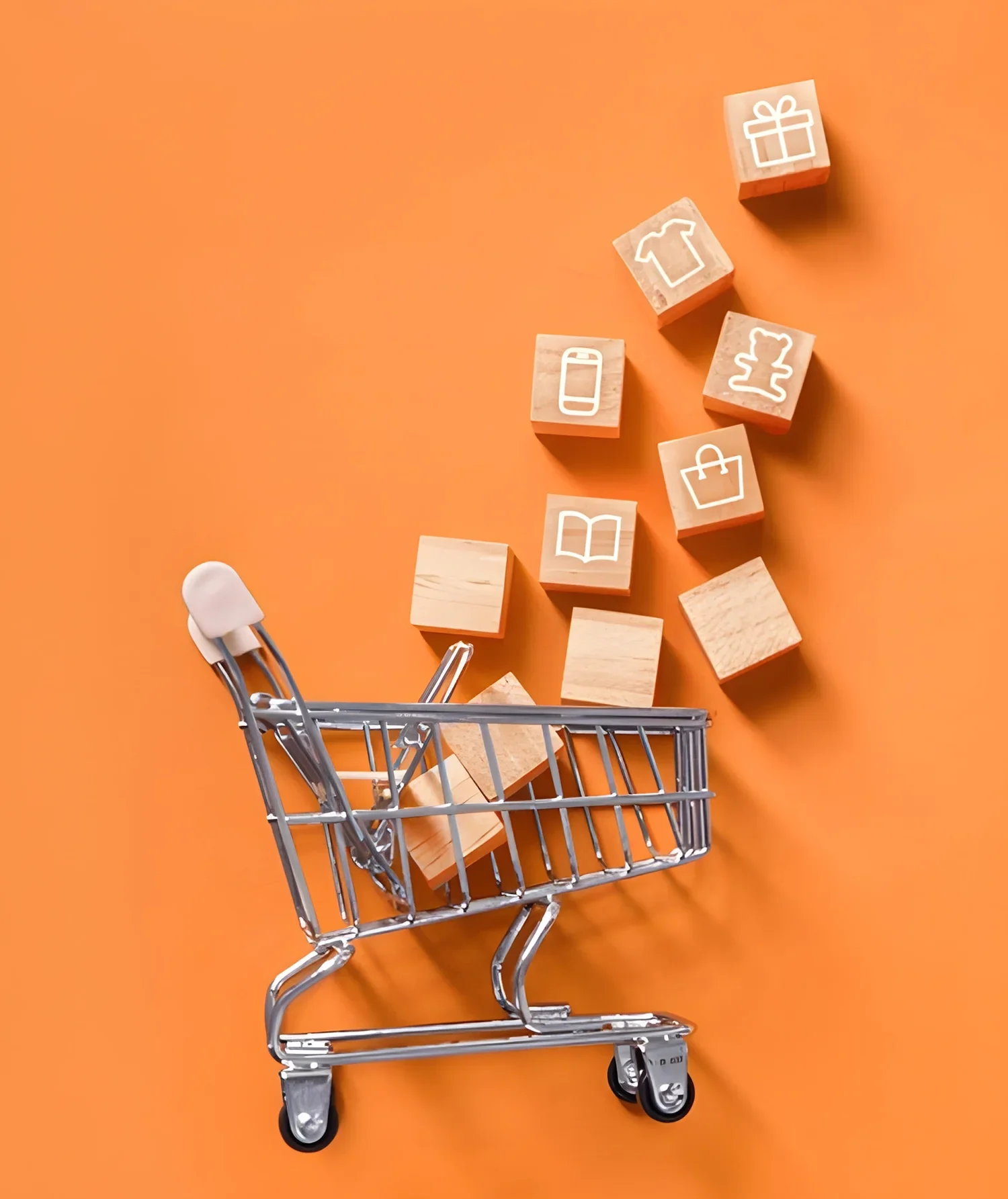 Shopping cart with wooden blocks representing ecommerce development